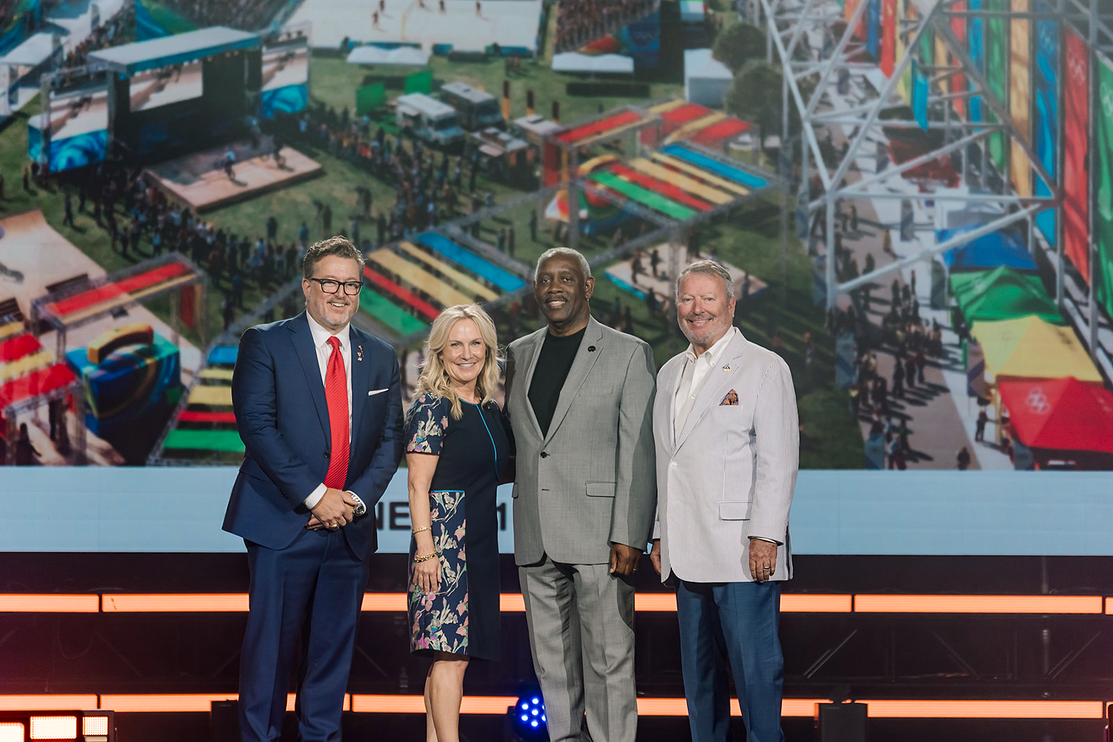City of Orlando Mayor, Orange County Mayor, and Visit Orlando President on stage together