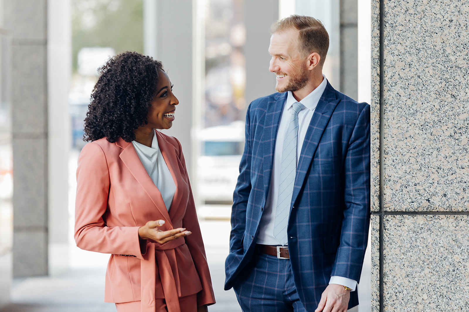 Business branding portrait of two professionals in conversation downtown