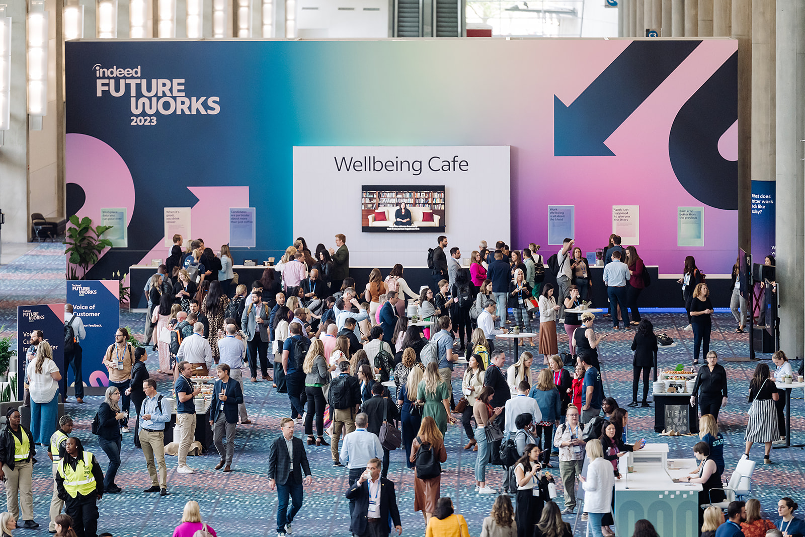 Attendees networking at the Wellbeing Cafe activation during Indeed FutureWorks 2023