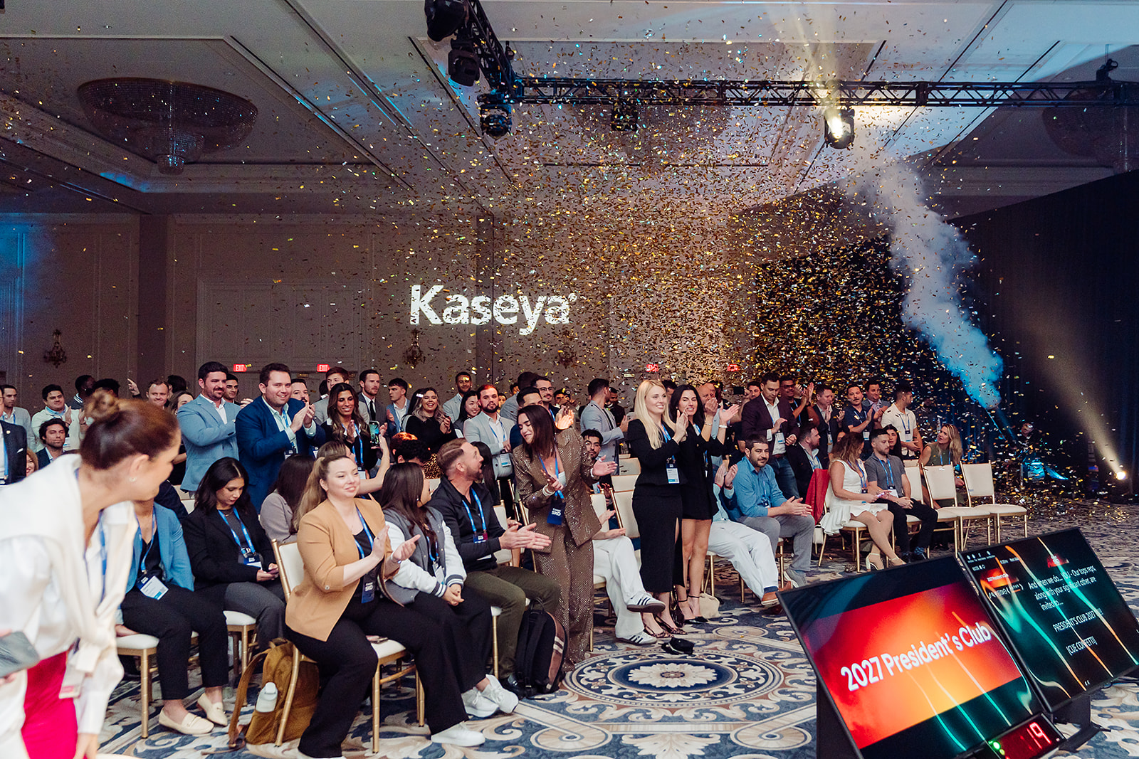 Kaseya President's Club winners celebrating with confetti cannons at SKO