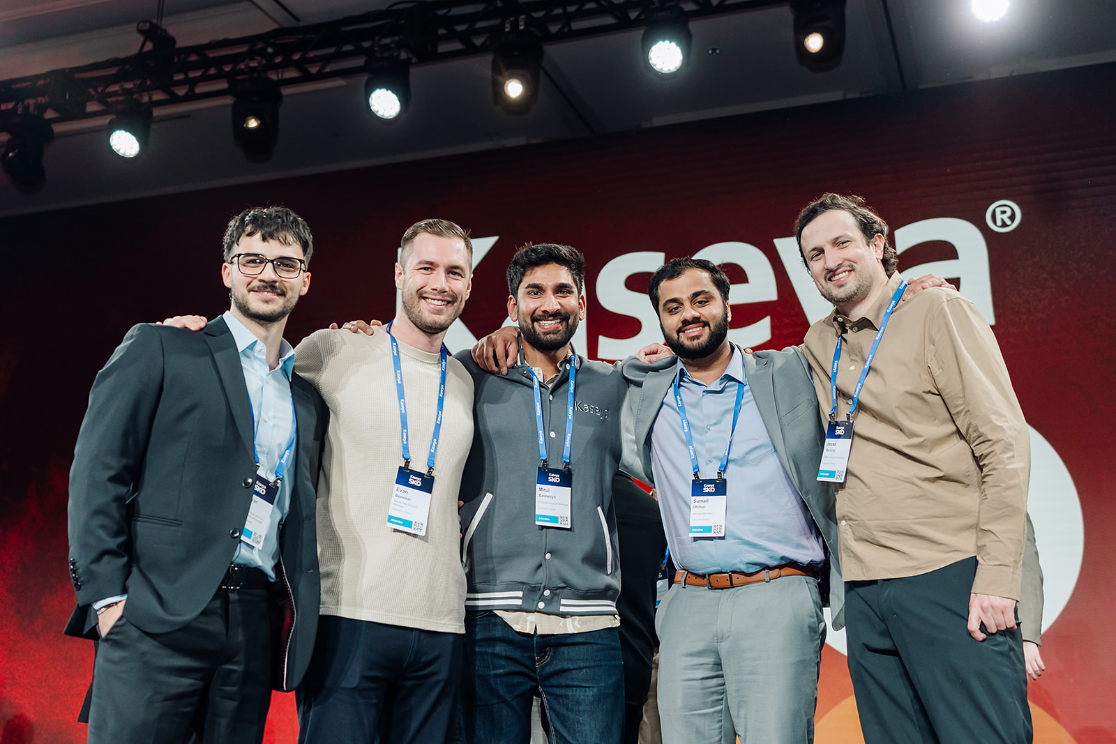 Group of Kaseya SKO attendees posing together on stage in Miami