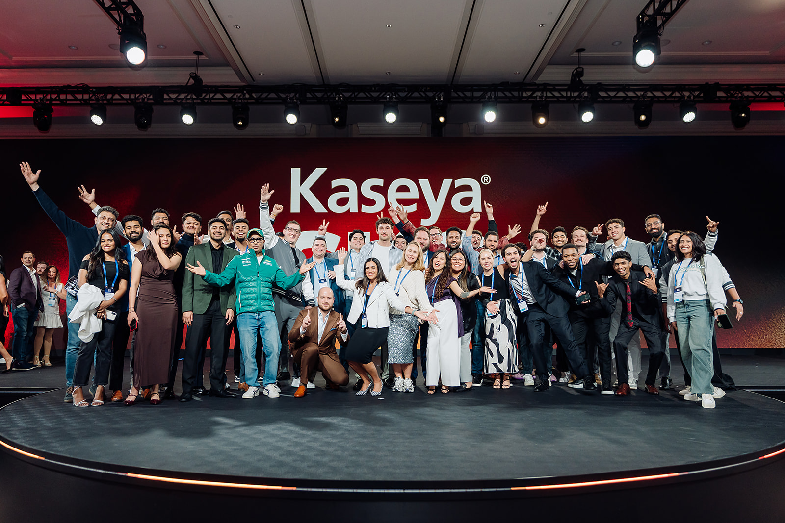 Kaseya SKO team group photo on stage in Miami