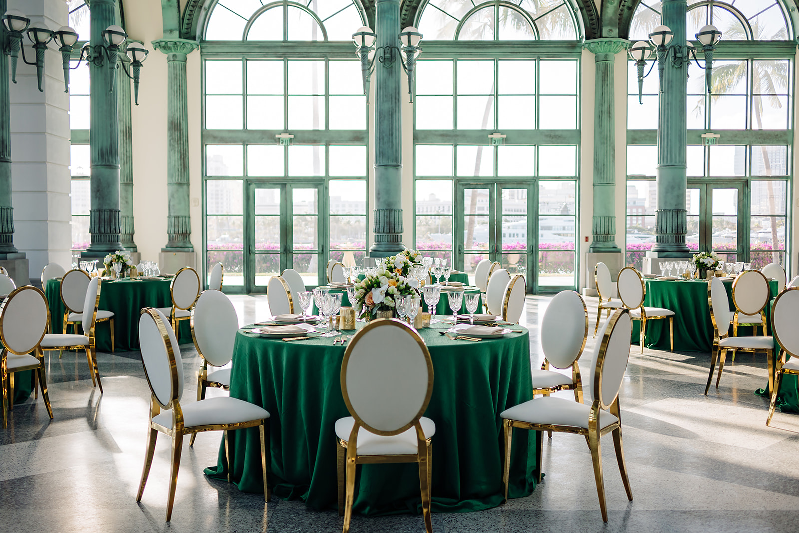 Wide view of corporate gala setup at Flagler Station Miami beneath historic arched windows