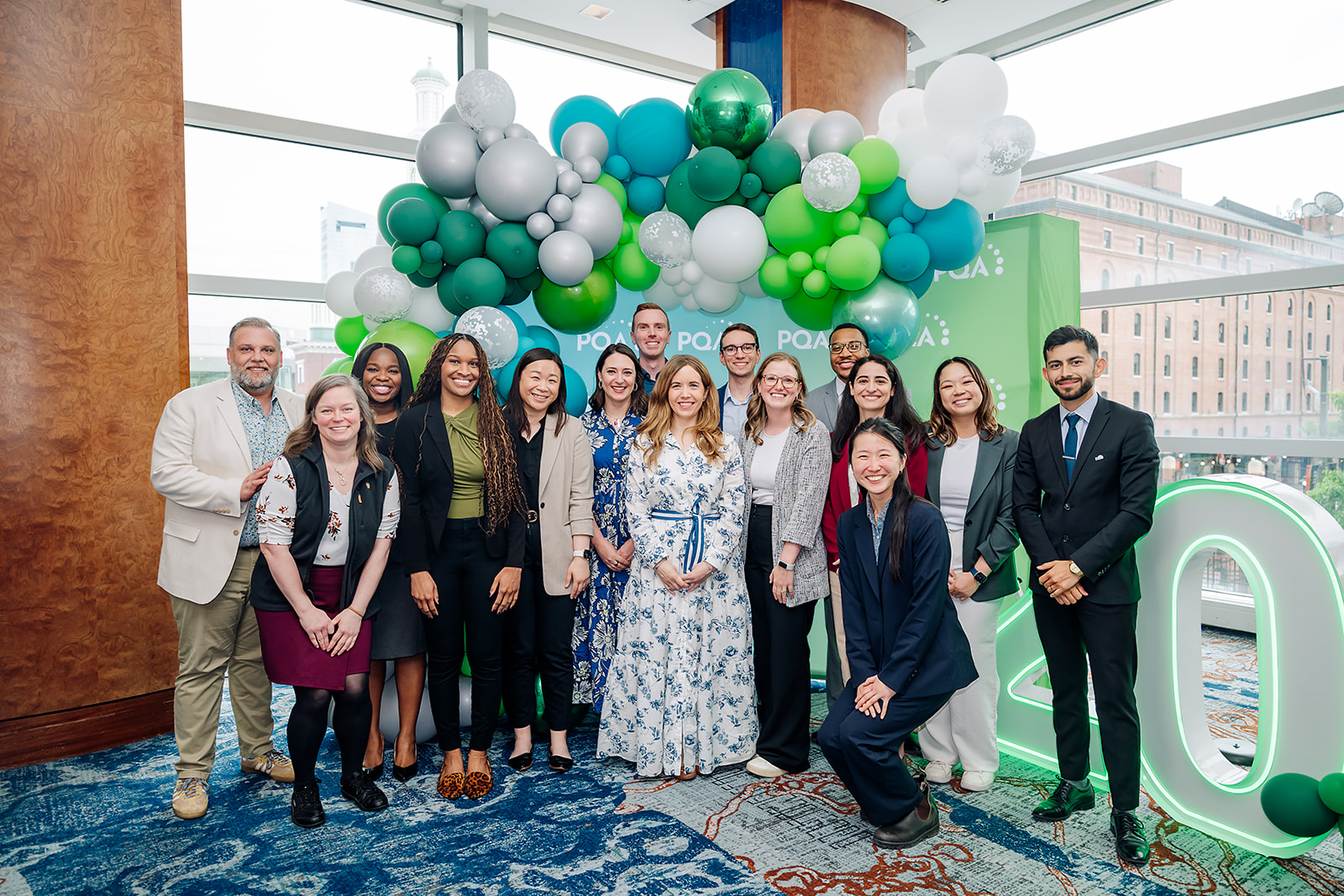 PQA Annual Conference award winners group photo with balloon arch in Baltimore
