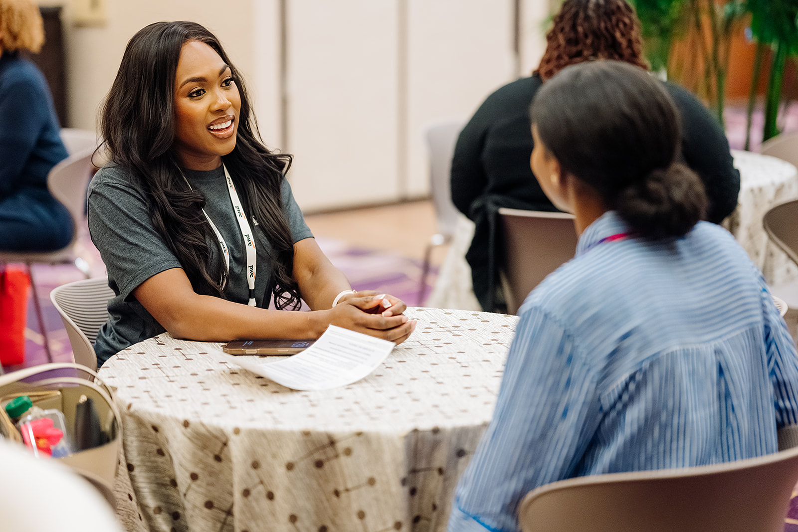 PwC WIN conference mentorship conversation between two attendees
