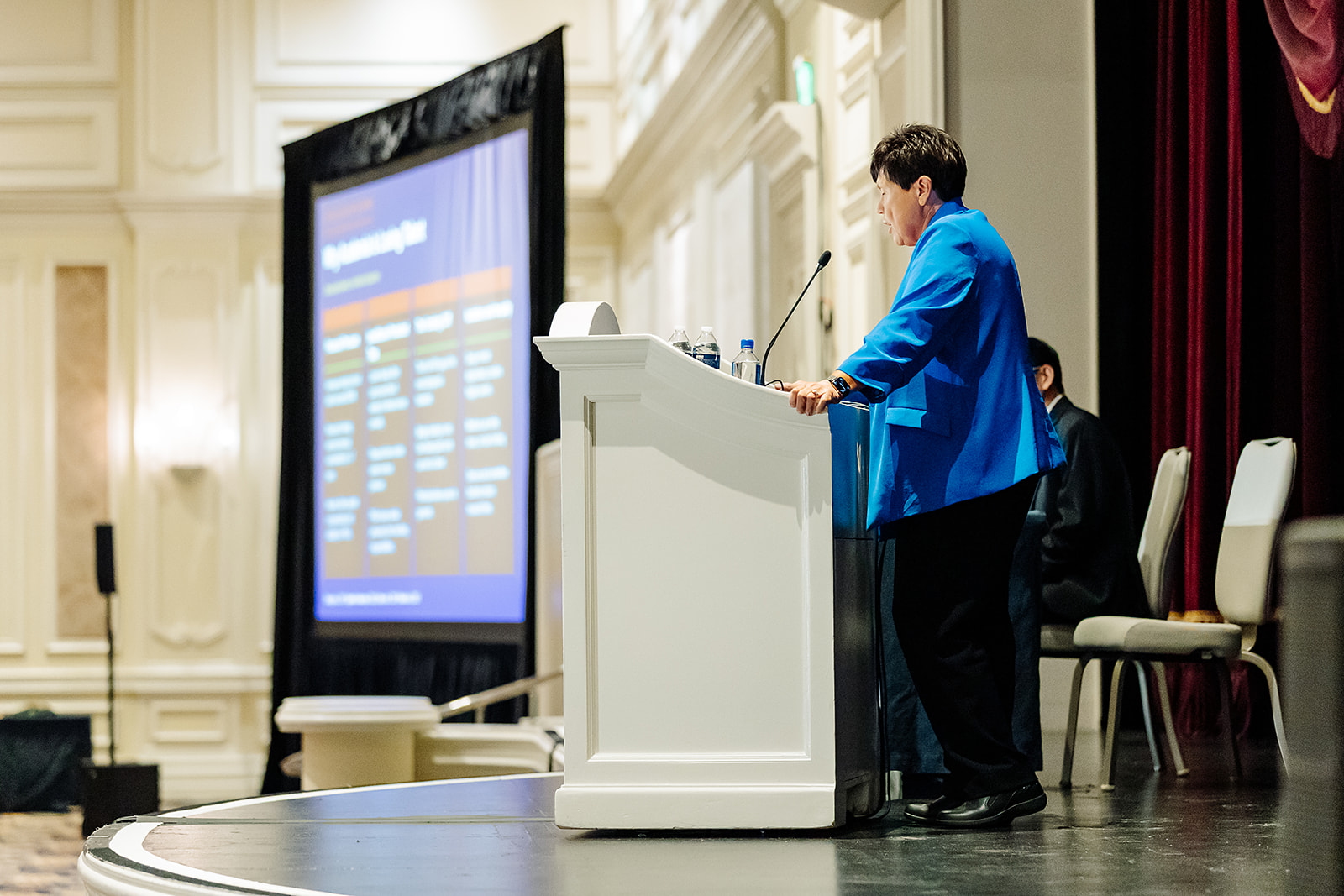 Speaker presenting slides on stage at Shock Society Las Vegas