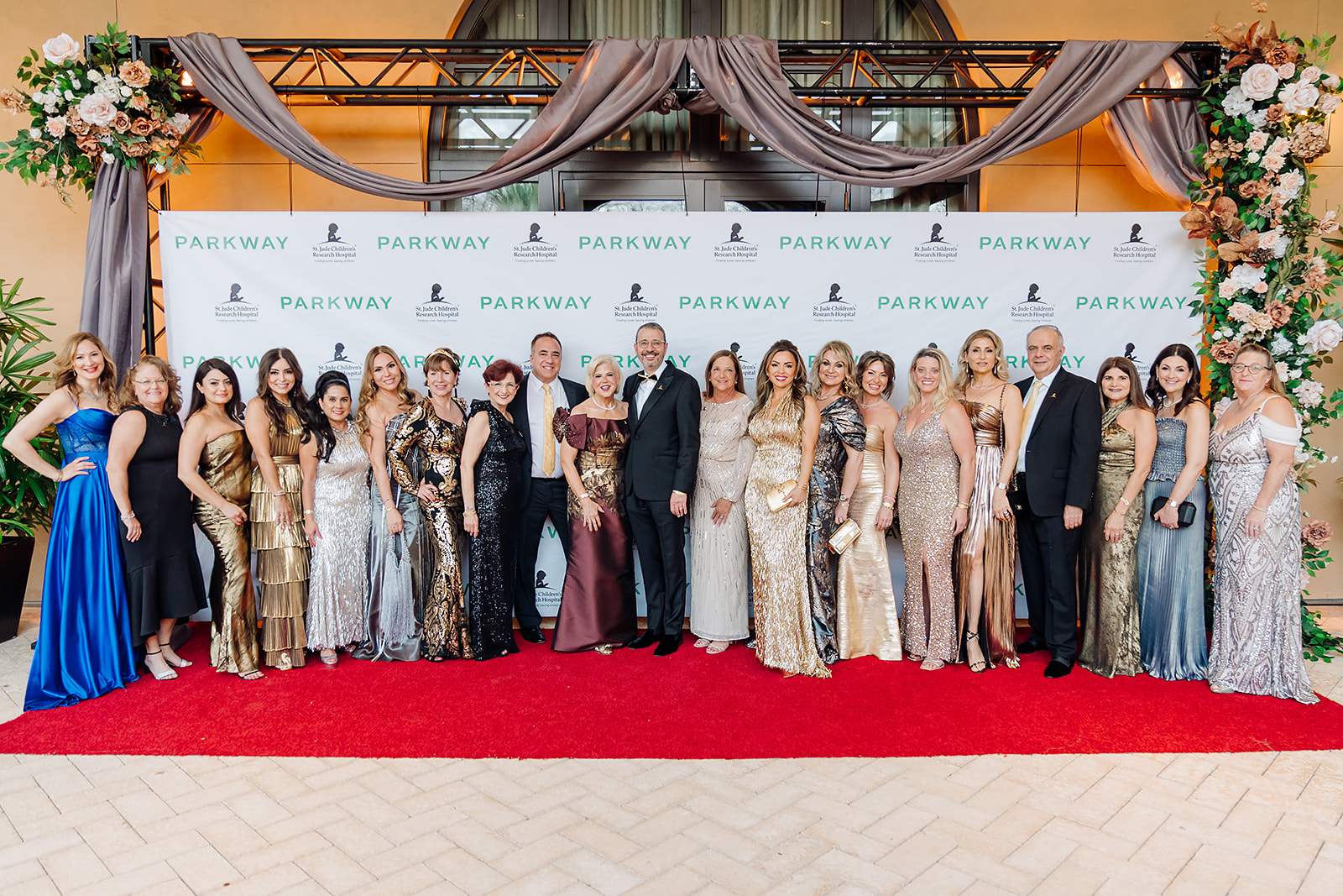 St. Jude charity gala group photo on the red carpet at Four Seasons Orlando