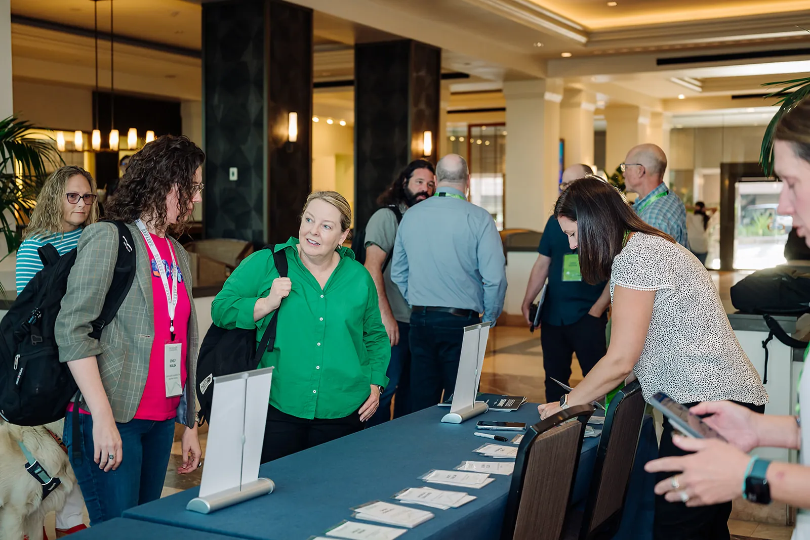 Foundant Summit attendees checking in at the registration desk in the hotel lobby in Tampa