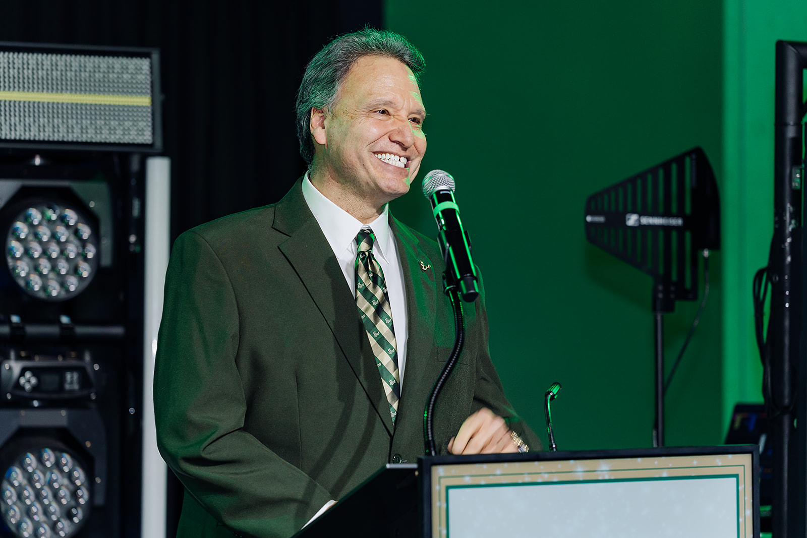 USF President speaking at the podium during the Green and Gold Gala