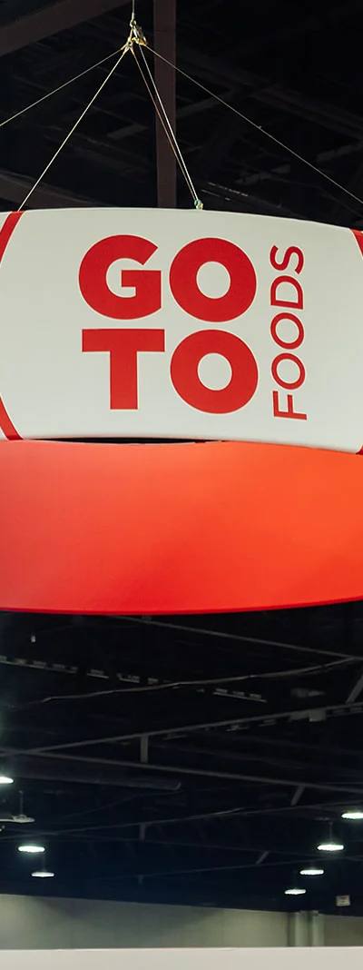 Overhead GoTo Foods branded circular signage hanging in the Georgia World Congress Center expo hall