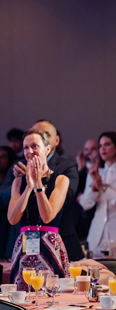 Attendees giving a standing ovation at a USHCC gala ballroom in Atlanta