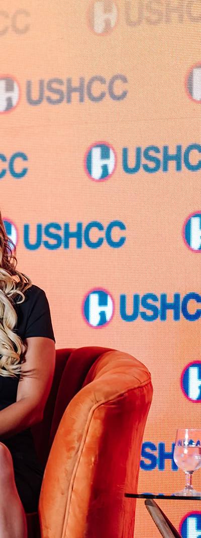 Fireside chat interview on stage in front of USHCC branded backdrop at the USHCC National Conference in Atlanta