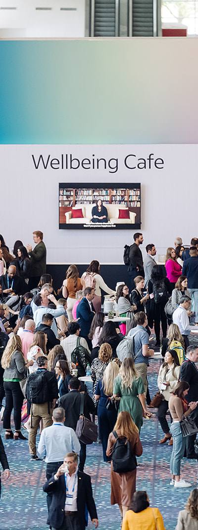 Attendees networking at the Wellbeing Cafe activation during Indeed FutureWorks 2023 in Atlanta