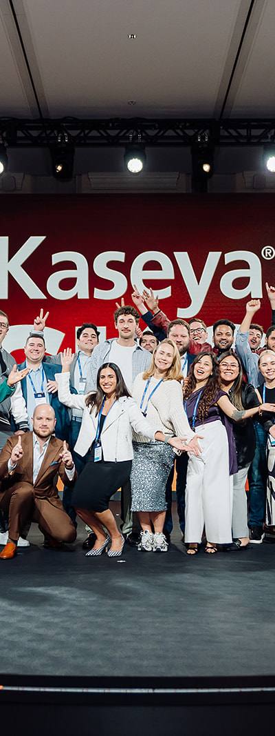 Kaseya SKO team group photo on stage in Miami