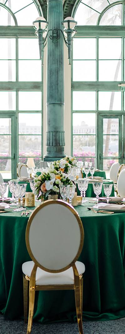 Corporate gala setup beneath historic arched windows at Flagler Station Miami