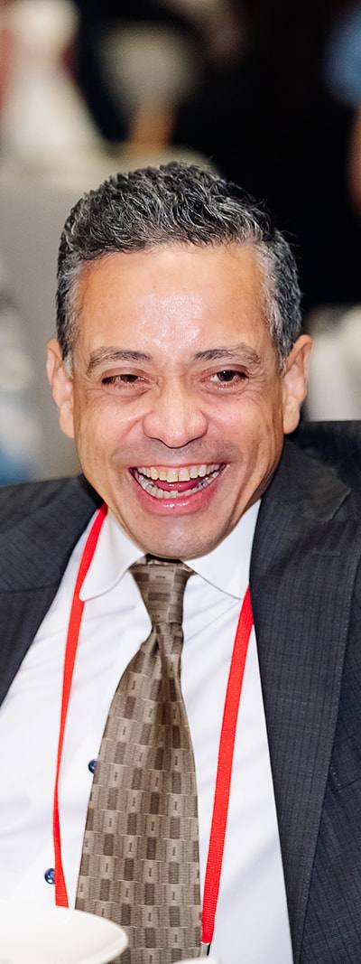 Attendee laughing at Shock Society awards gala dinner in Las Vegas