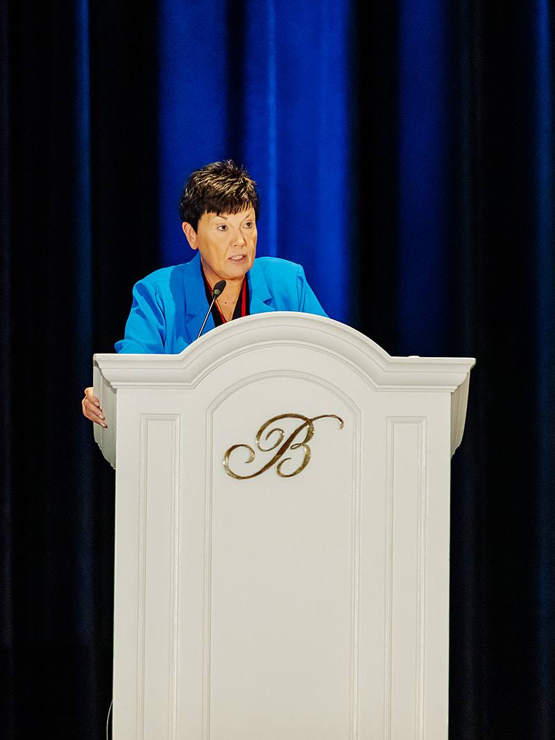Shock Society keynote speaker at Bellagio podium in Las Vegas